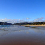 La longue plage entre West Head et…